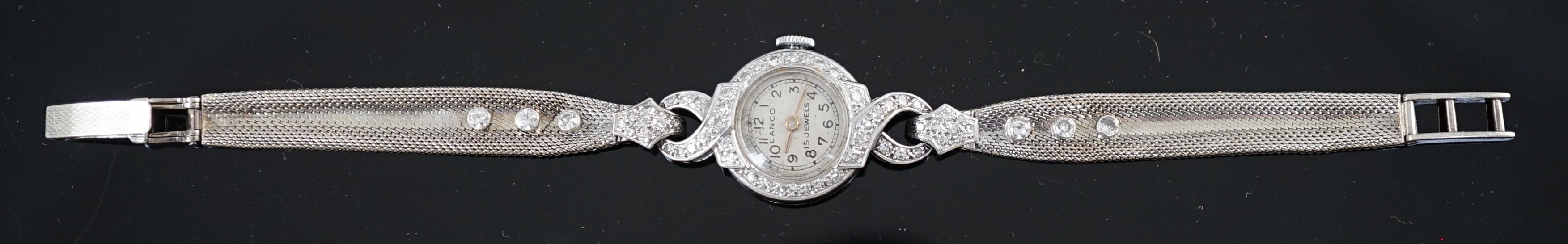 A lady's platinum and diamond set Lanco manual wind cocktail watch, on a 9ct gold and six stone diamond set bracelet